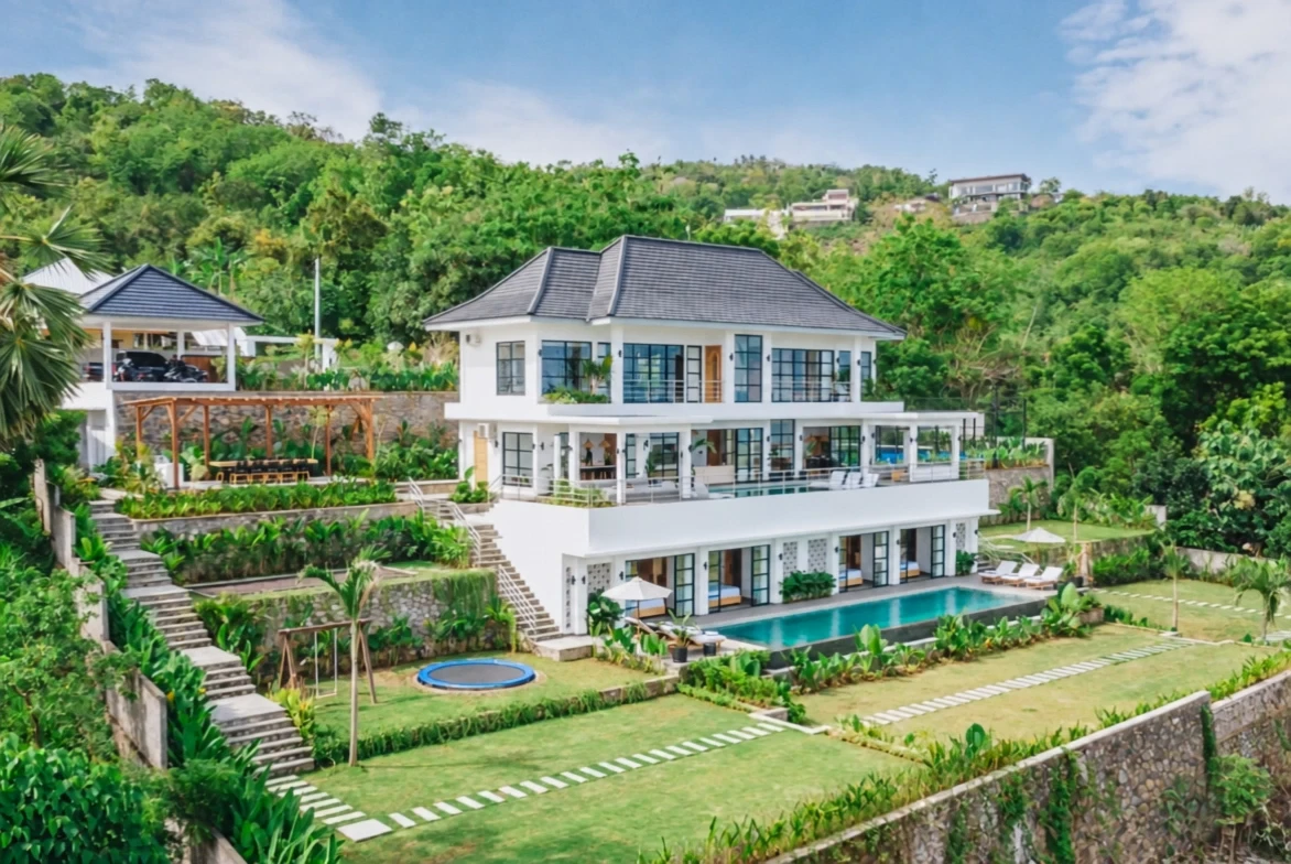 Oblique aerial view of Villa Sunset, its pools and tropical garden.
